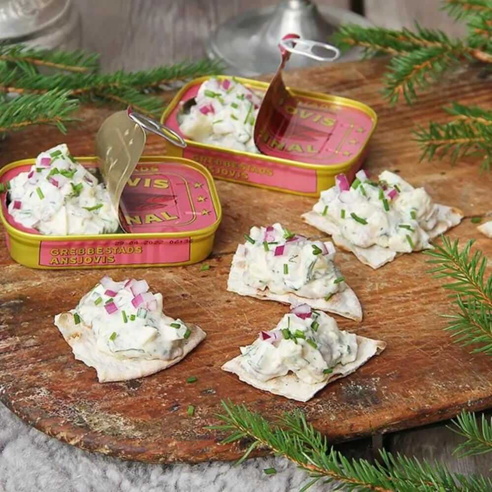 Grebbestads Ansjovis Original Abba, Swedish Anchovy Fish & Sprats Delicacy, Can 125g (4.40oz) served on crackers with toppings.